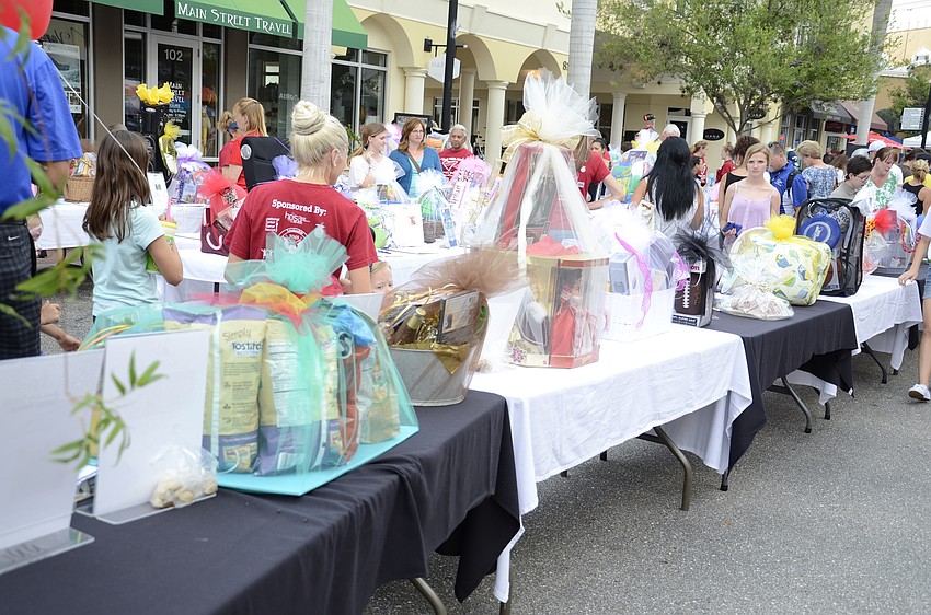 Gift baskets await bids at the silent auction.