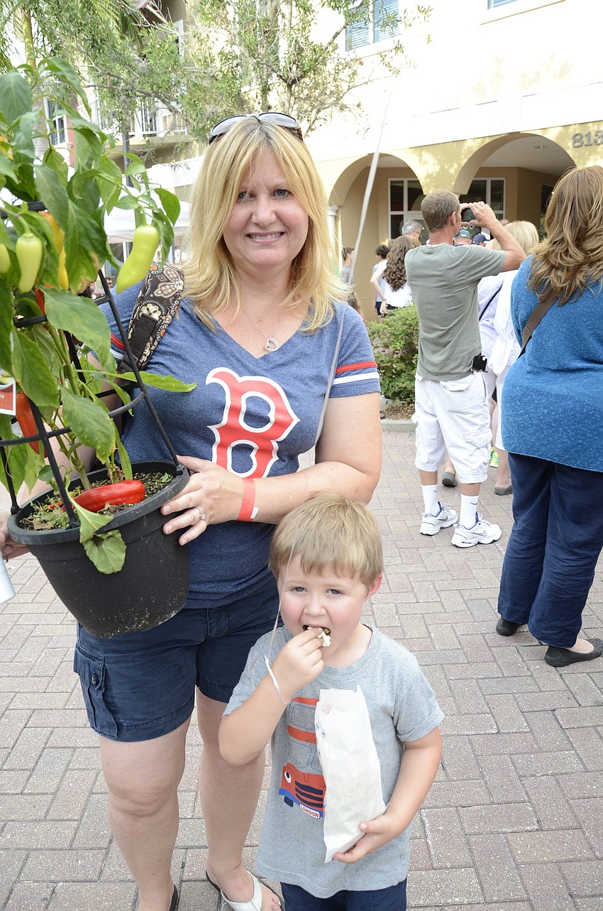 Kristin Murphy, a Nolan mom, and her son, Beau, 4, bought a sweet banana pepper plant at a booth. 