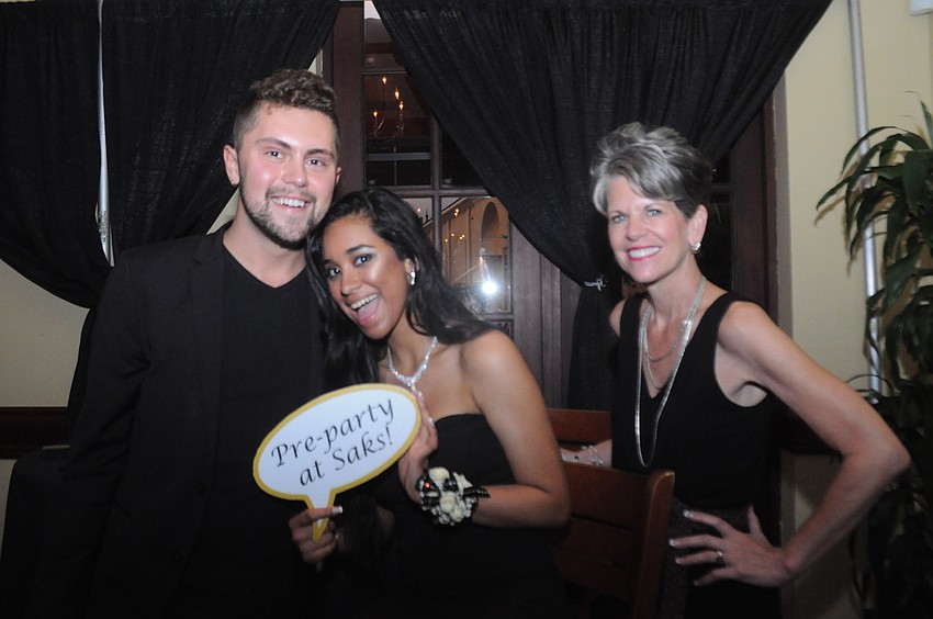 Alex Relyea and Sally Schule with Sax Fifth Avenue set up a lipstick bar to touch up the girls' makeup at prom—Alexxa Ordonez, center, took advantage of the service.