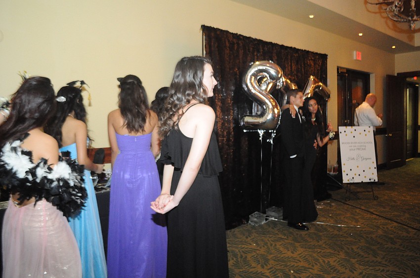 Students wait in line for the Hello Gorgeous photo booth.