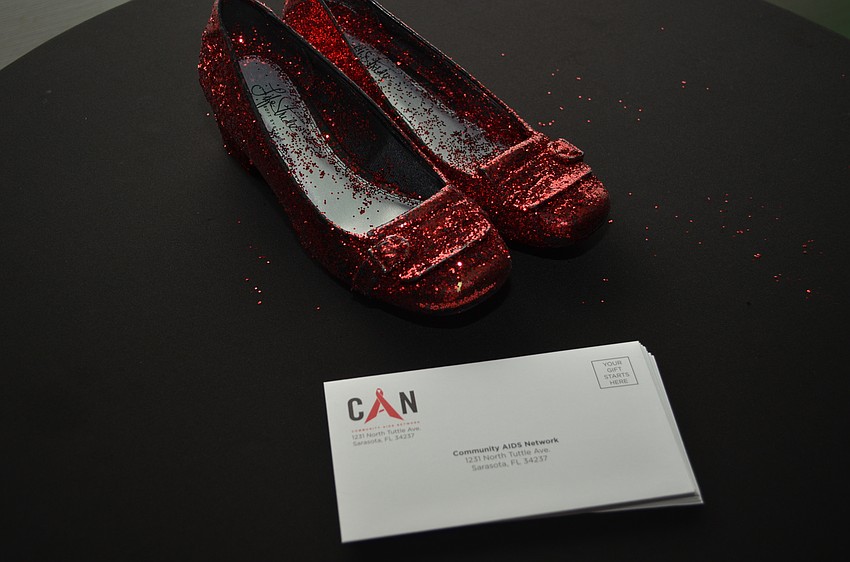The Community AIDS Network put on their red ruby slippers for a night of fundraising and awareness with a sing-a-long exhibition of the movie classic.