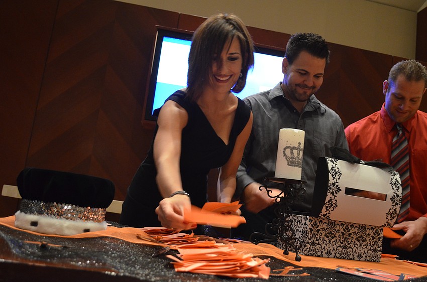 Lisa Achille helps count votes for the prom king and queen nominees.