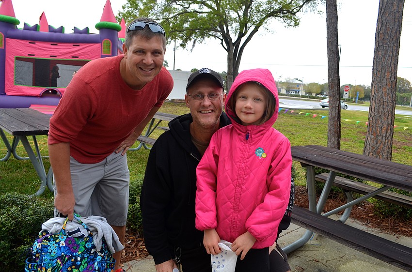 Justin Rhinesmith talks with David Martin, and his daughter, Sara.