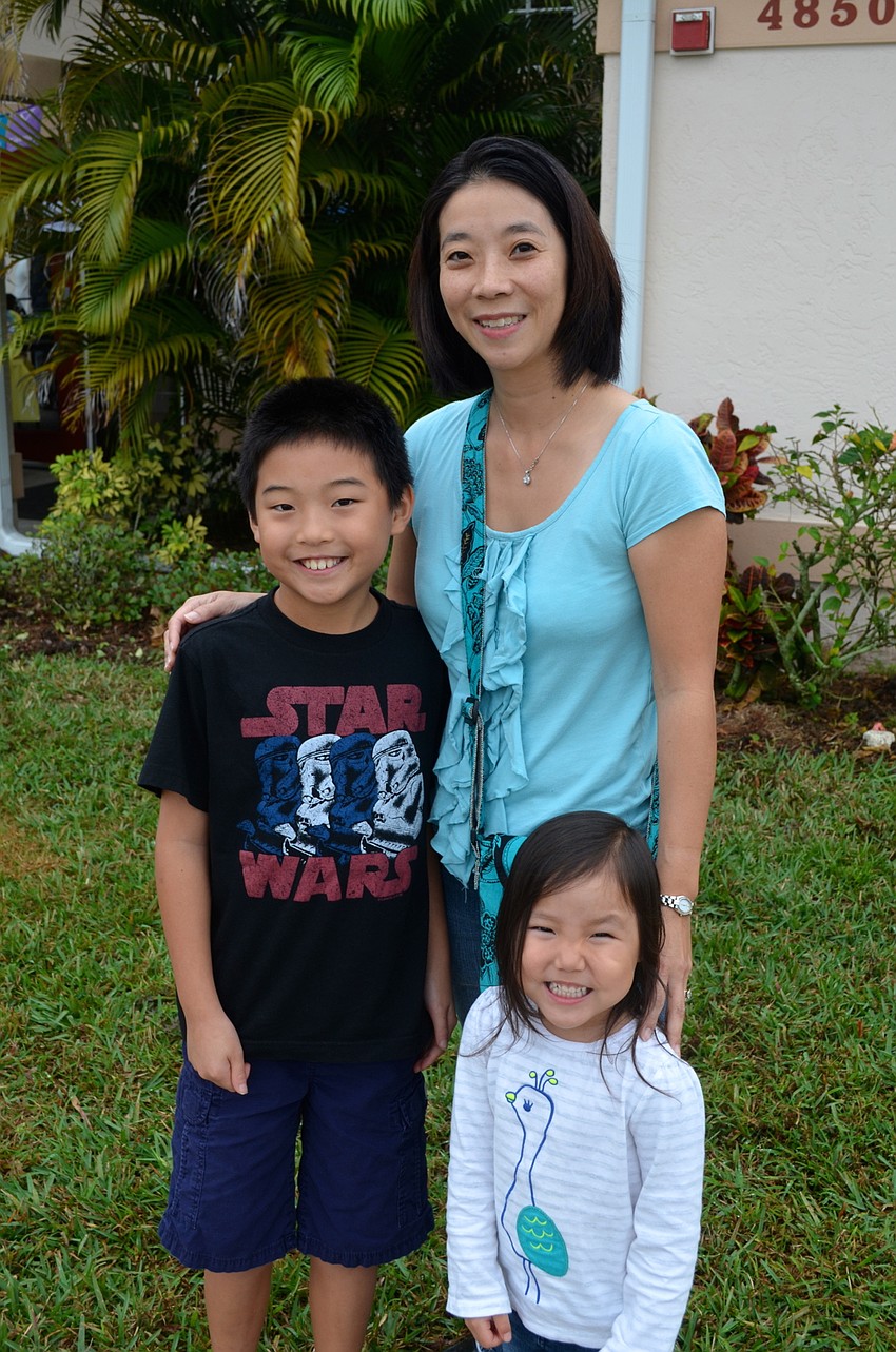 The Stochl family — Thomas, Melissa and Julia — arrive just in time to miss the rain.