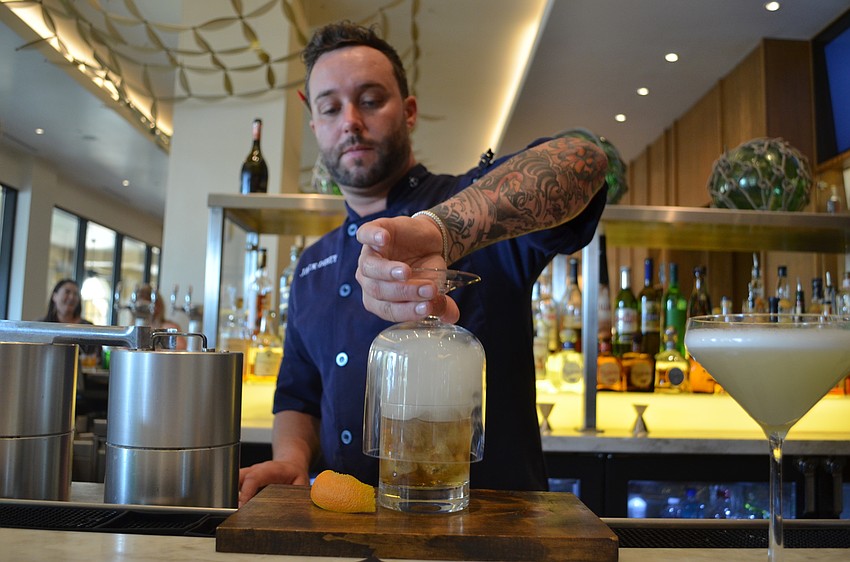 Nick Vaccaro revealing the smoke topping to the Over the Barrel.