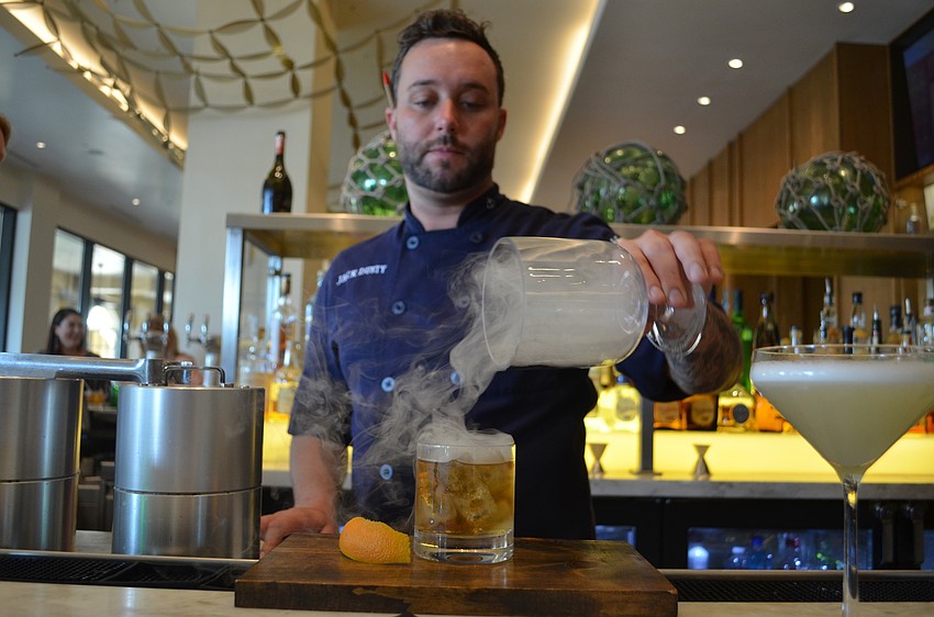 Nick Vaccaro revealing the smoke topping to the Over the Barrel.