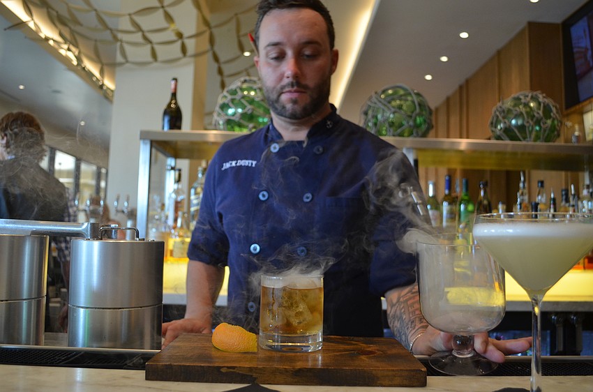 Nick Vaccaro revealing the smoke topping to the Over the Barrel.