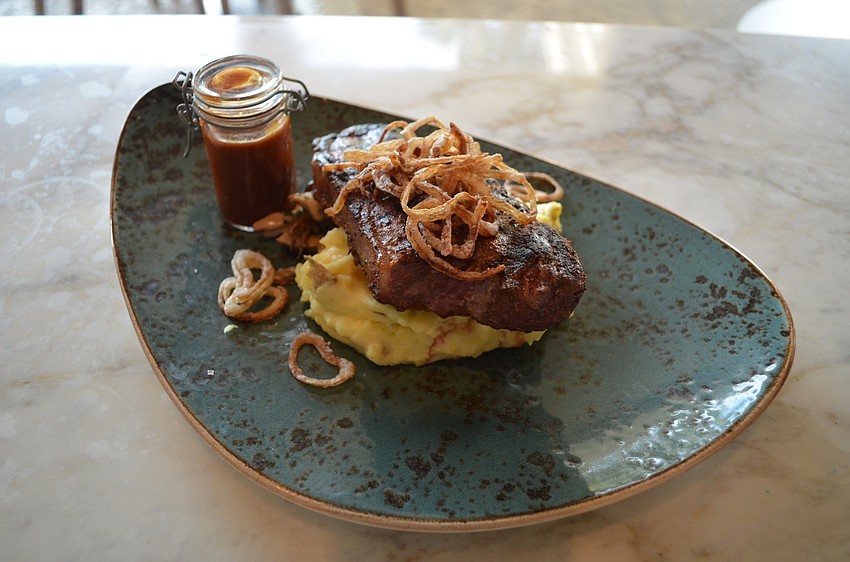 “Joffrey’s” Coffee Rubbed N.Y. Strip (seasonal mushrooms, crushed Yukon gold potatoes and house steak sauce)