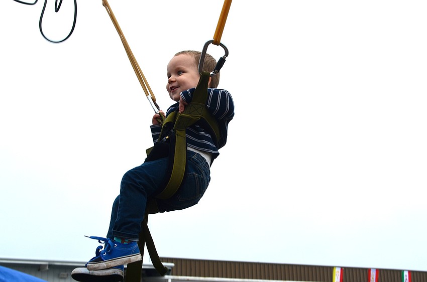 Two-year-old Levi Cox enjoys bungee jumping.