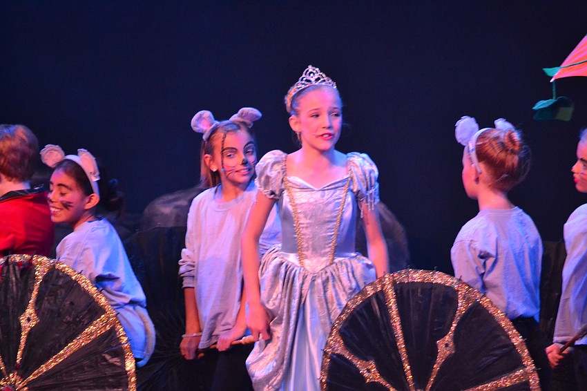 Ella Wicks as Cinderella prepares to arrive at the ball.