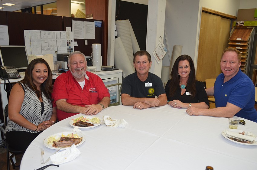 Renee Dinan, of the Pink Hanger, Jack Dean, of G. Fried FlooringAmerica, Pedro Reis, of the Circus Arts Conservatory, Michelle Brault, of the Circus Arts Conservatory, and Robert Dinan, of Dinan Realty Group