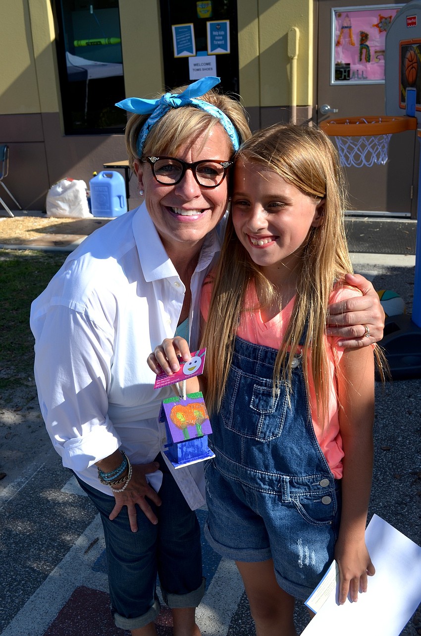 Media Center Specialist Betsy Hall says cheese with Lylianah Robertson.