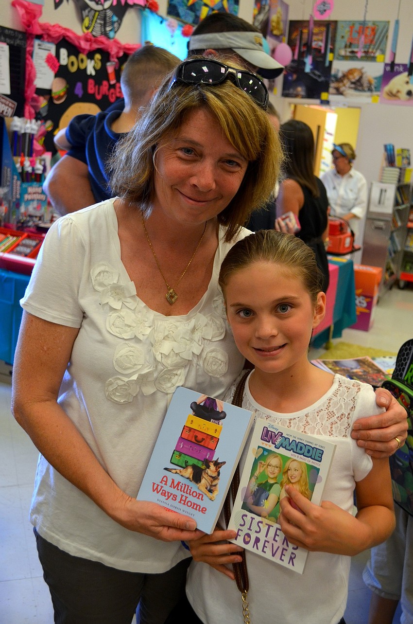 Valerie and Sarah James browse the books that are for sale.