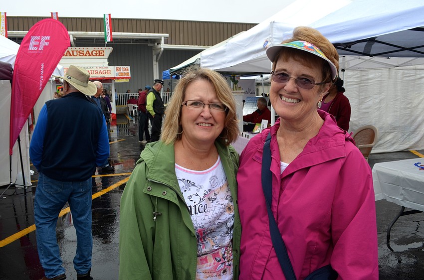 Sisters-in-law Cindy and Patti Lee peruse the vendors.