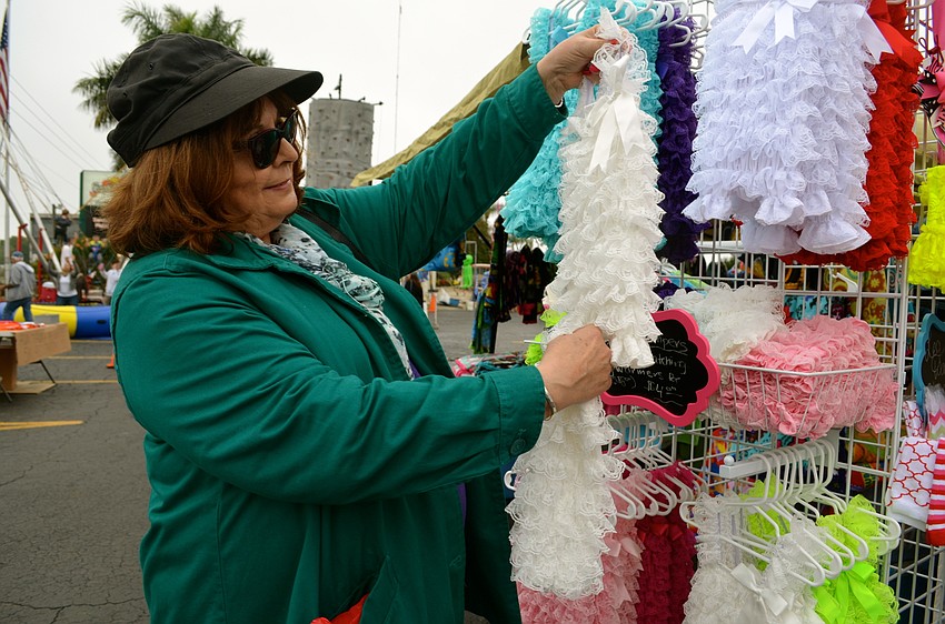 Pamela Pegram browses for an outfit for a friend’s daughter.