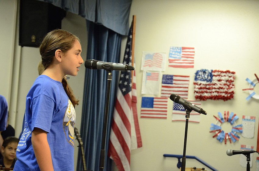 Willianny Reyez speaks during the fifth-grade performance.