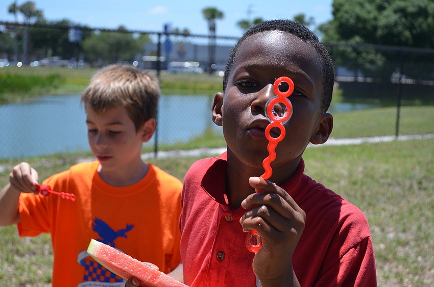 Onyemachi Obioha blows bubbles.