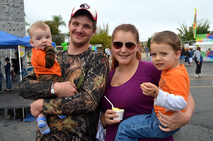 The Shaffer family — Tucker, Brian, Thomasina and Conner — ignore the rain and find fun outdoors.
