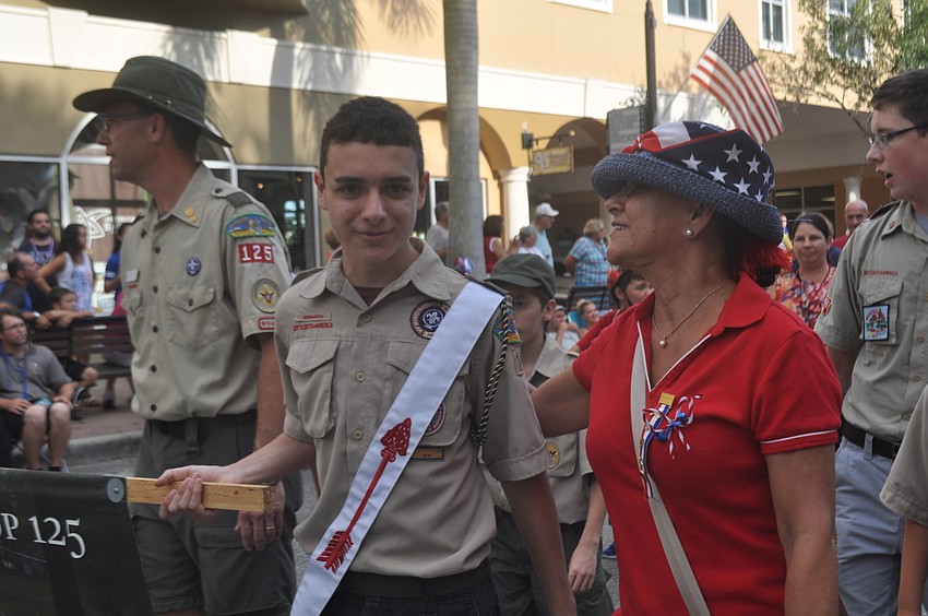 John Coker walks with his mom, Tatiana, and the Lakewood Ranch Boy Scout Troop 125.