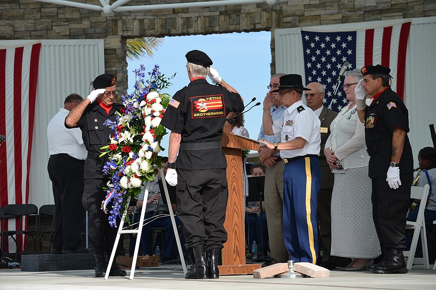 Families of armed forces members killed in action, also known as Gold Star Families, are presented with a wreath to commemorate their sacrifices.