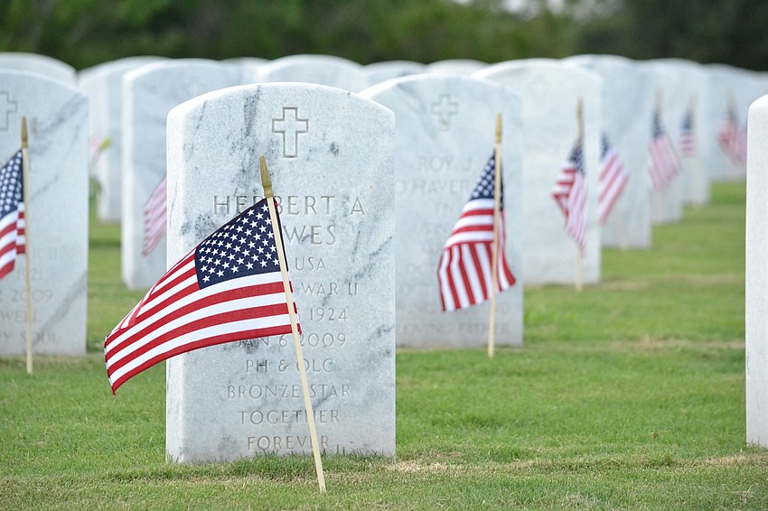 Headstones at Sarasota National Cemetery were adorned with American flags from the organization Flags for Fallen Vets.