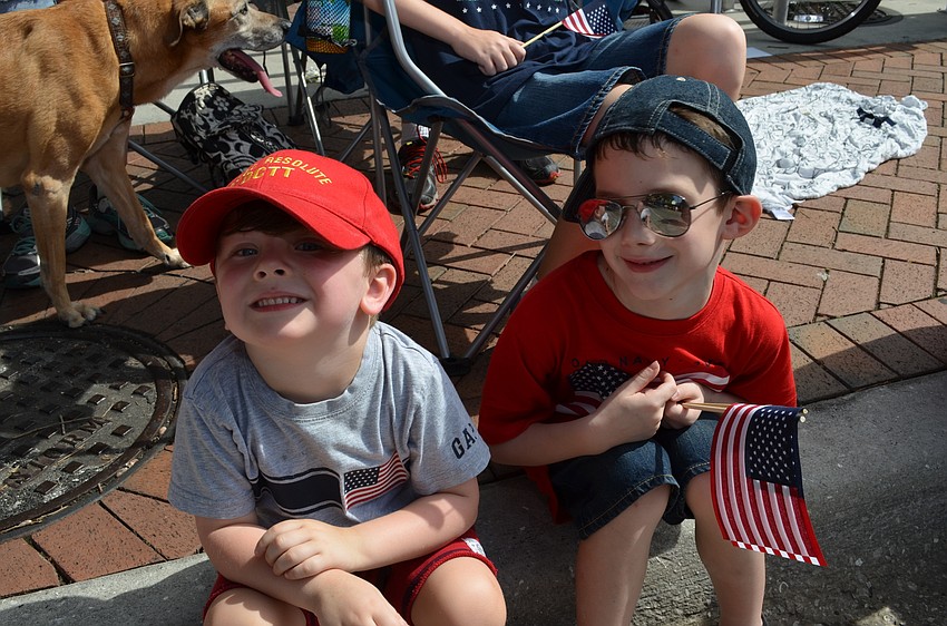 Wyatt Boyette and Cade Henegar cheer during the parade.