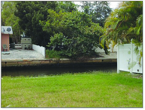 A dilapidated seawall that needs repaired at 759 St. Judes Drive N. has caused a rift between the commission and its code board.