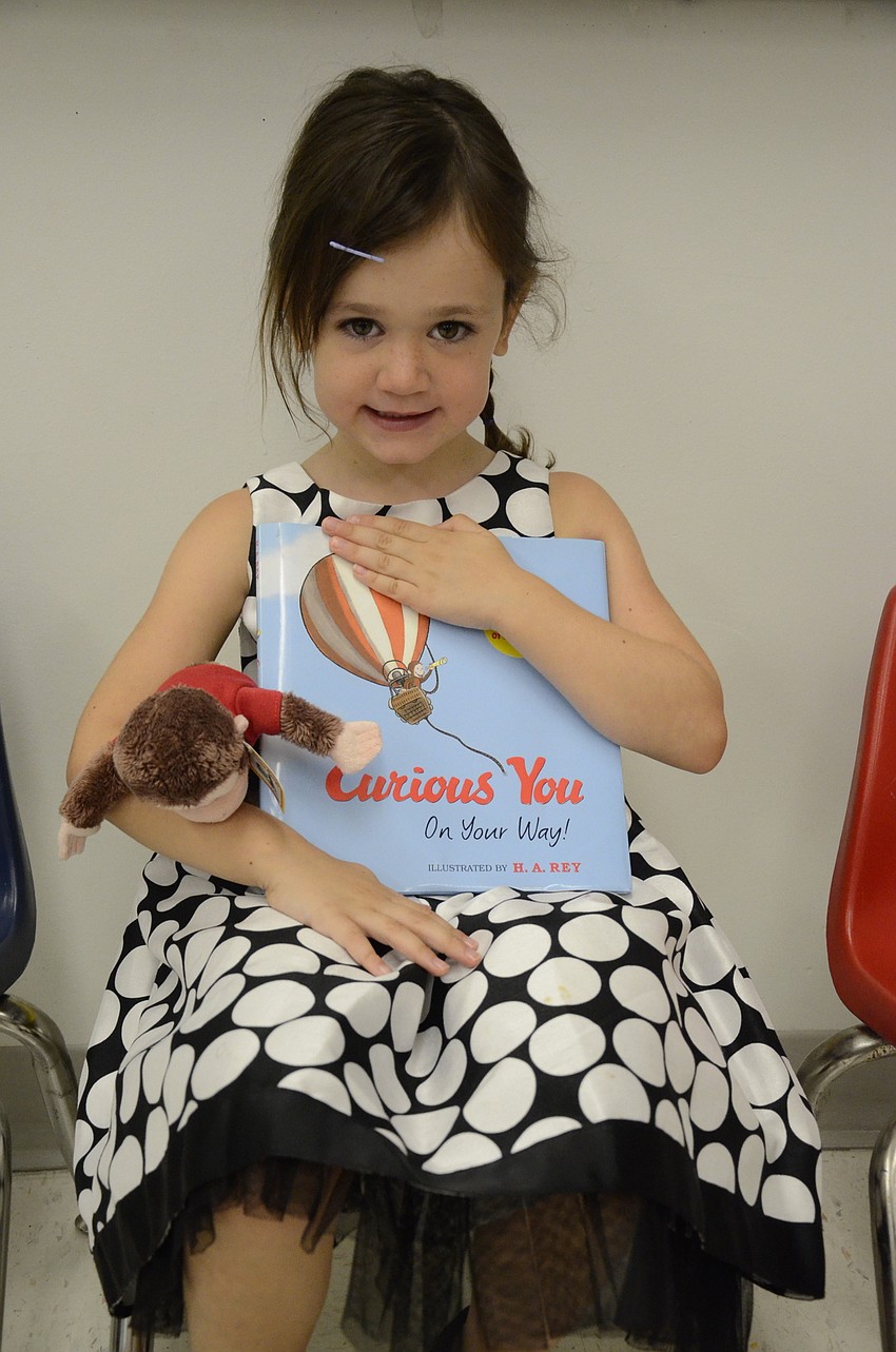 Carrie Sarkissian's mom, Amy, is starting a tradition: at the end of each school year, Carrie's teachers will sign her copy of Curious You, a Curious George book.