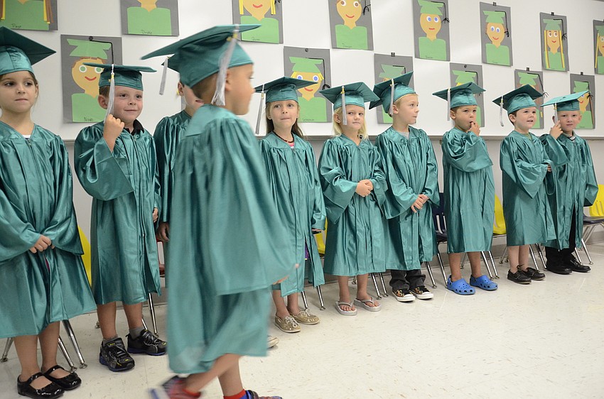 Each student—some solemn, some silly—walked to get their diploma.