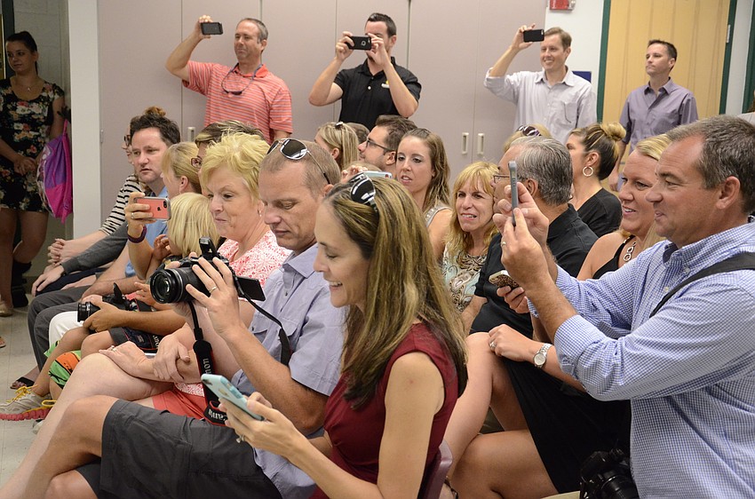 Proud parents and family caught the graduation on camera.