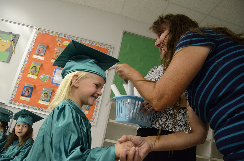 Quinn Krug patiently waits for her tassle to be turned.
