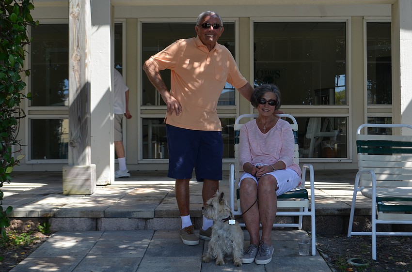 Pat and Mike Frain with dog, Wrigley