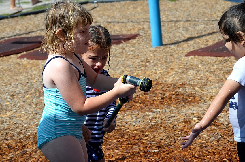 Ryleigh Gaffney is ready to spray her friends with cold water.