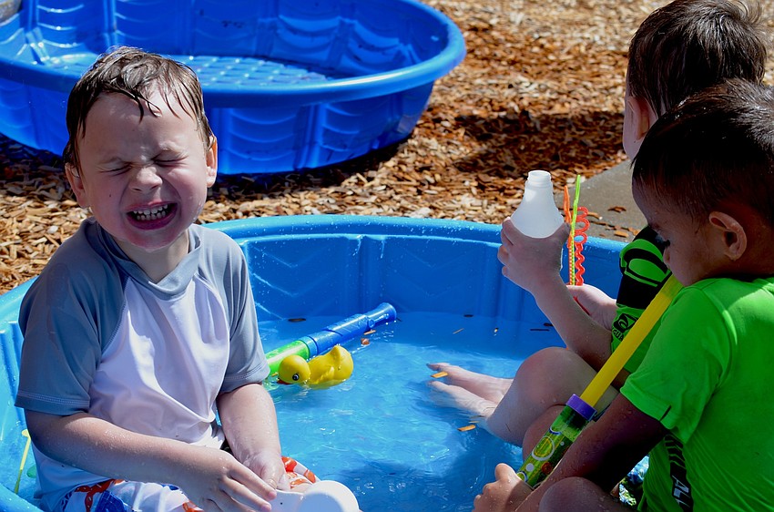 Carson Smith braces for a water attack in the pool.