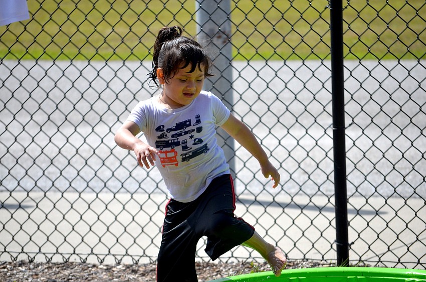 Terezo Vela-Herrera pool hops around the playground.
