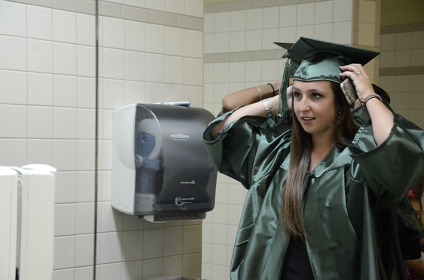 Alexandra Zagorski checks her cap one last time before lining up.