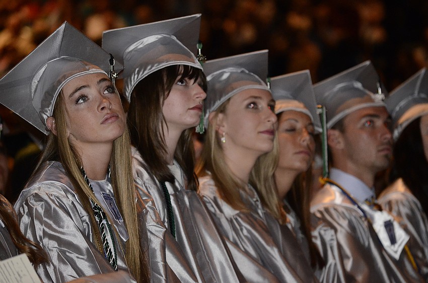 Students watched the class movie, a conglomeration of photos and clips from their four years.