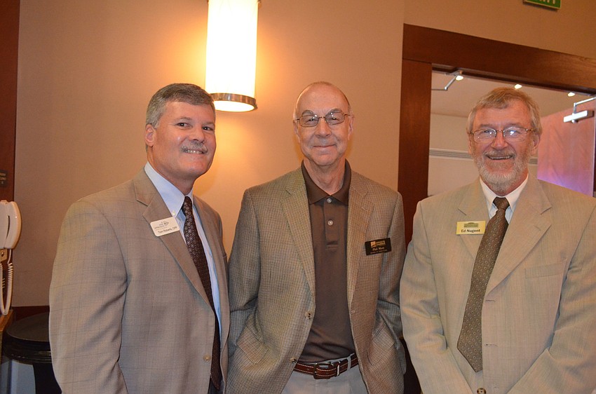 Tom Roberts, of A New Approach Financial Planning, Phil Mott, of Morgan Stanley, and Ed Nugent, of Cornerstone Signs and Graphics