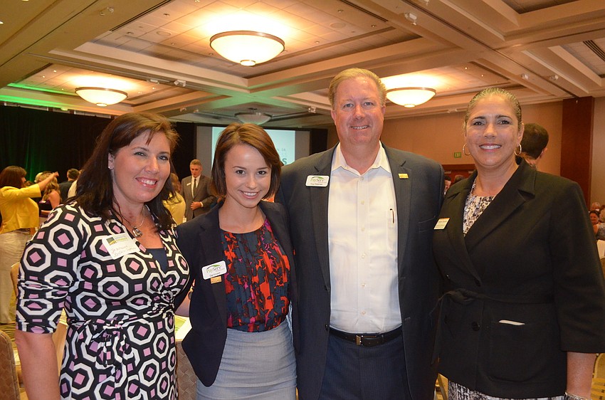 Jill Hollywood, Young Professional of the Year finalist Gigi Kovach and Troy Peterman, of PayServ Systems, with Kimberlie Buchanan, of Shinn & Company