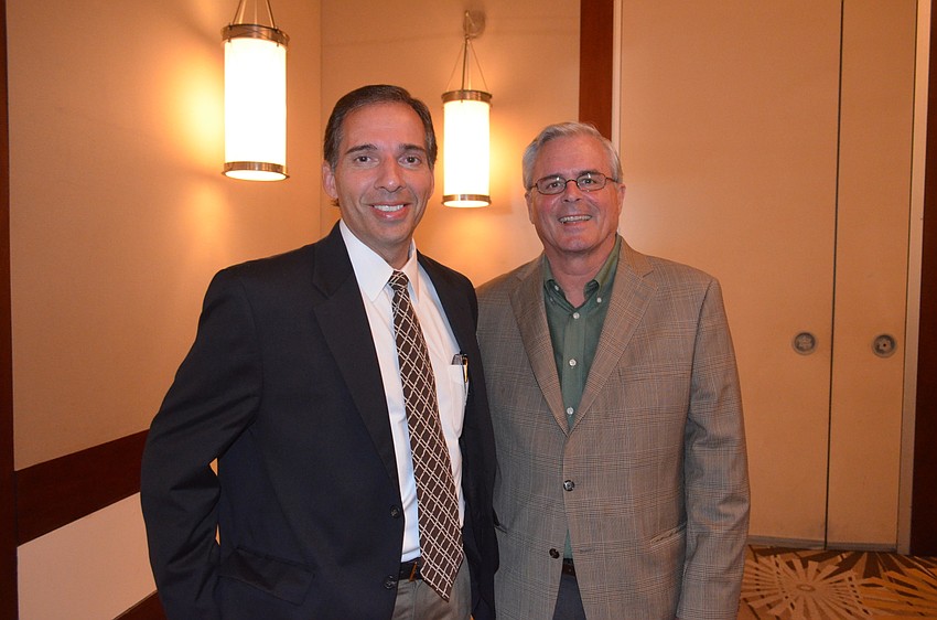 Joseph Fierro, of Liberty Savings Bank, and Danny Bilyew, field representative for Congressman Vern Buchanan