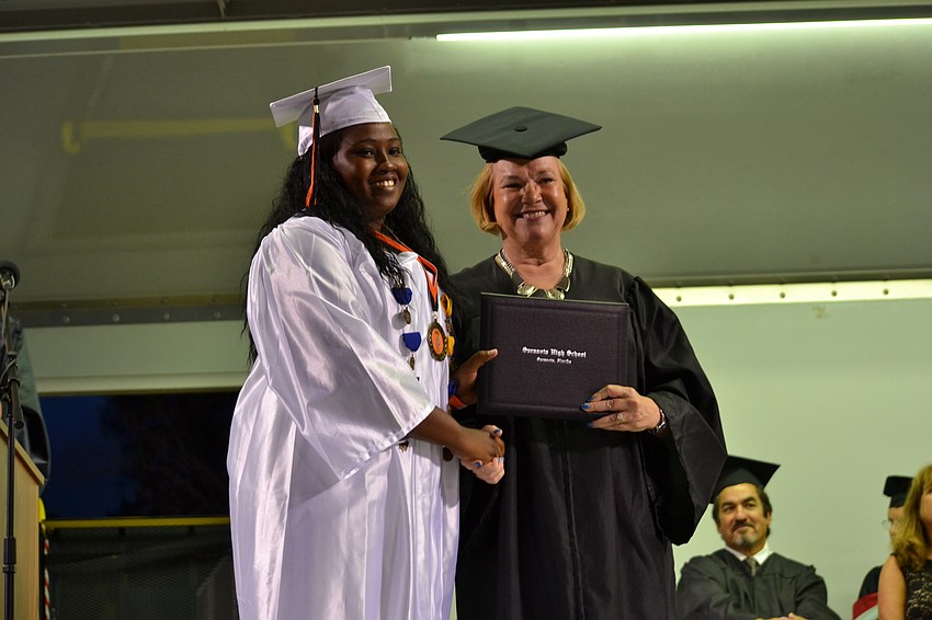 Cierra Alexander receives her diploma.