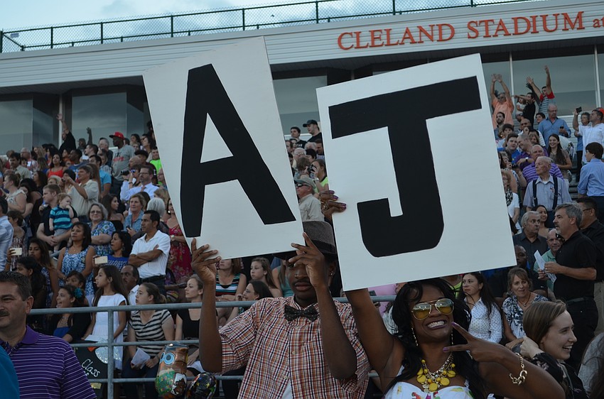 Elijah and Kalena Bowers show support for their graduate AJ Taylor