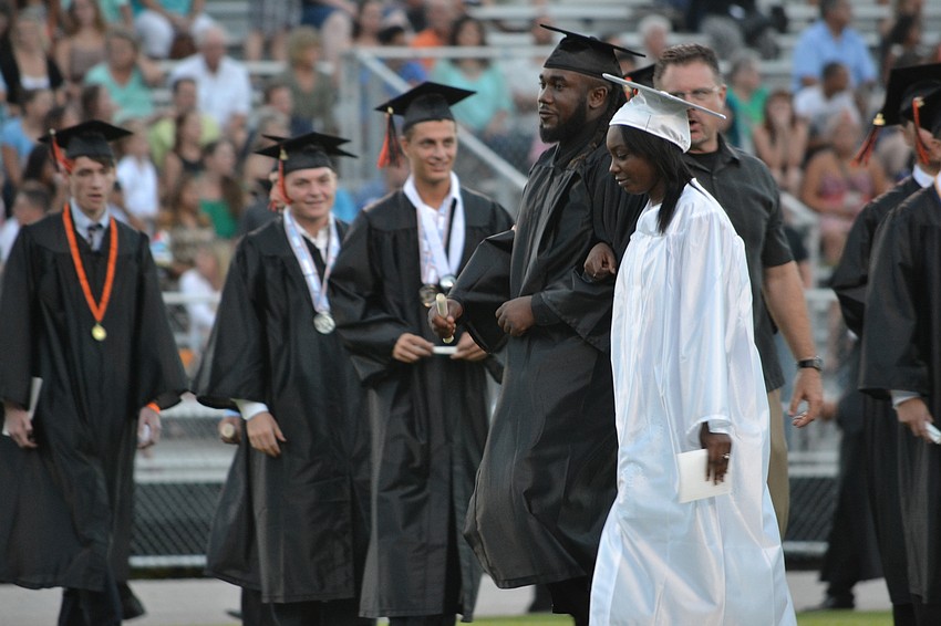 Students enter for the 2015 Sarasota High School commencement ceremony.