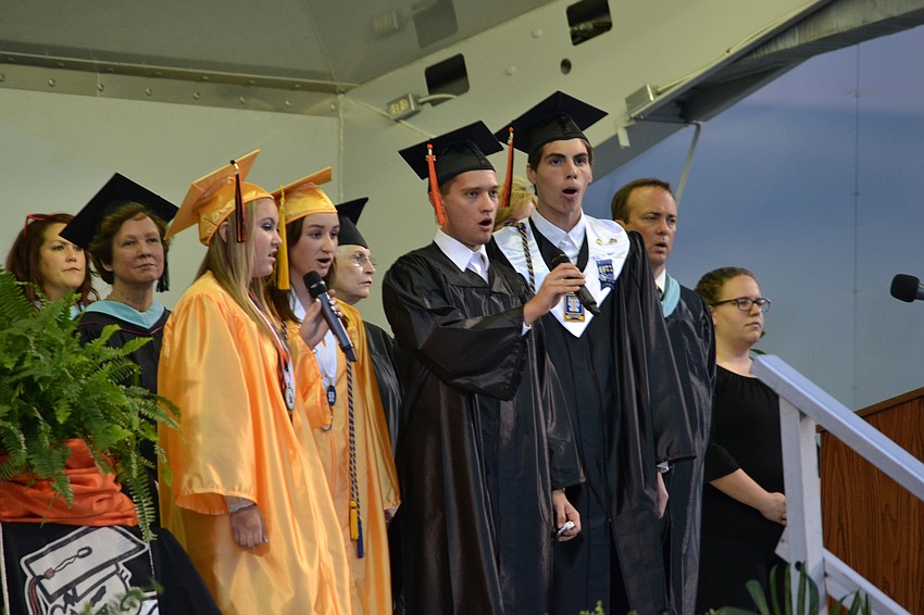 Students Kira Marino, Gina Panik, Grady Griffin and Javier Negron-Rivera perform the national anthem.