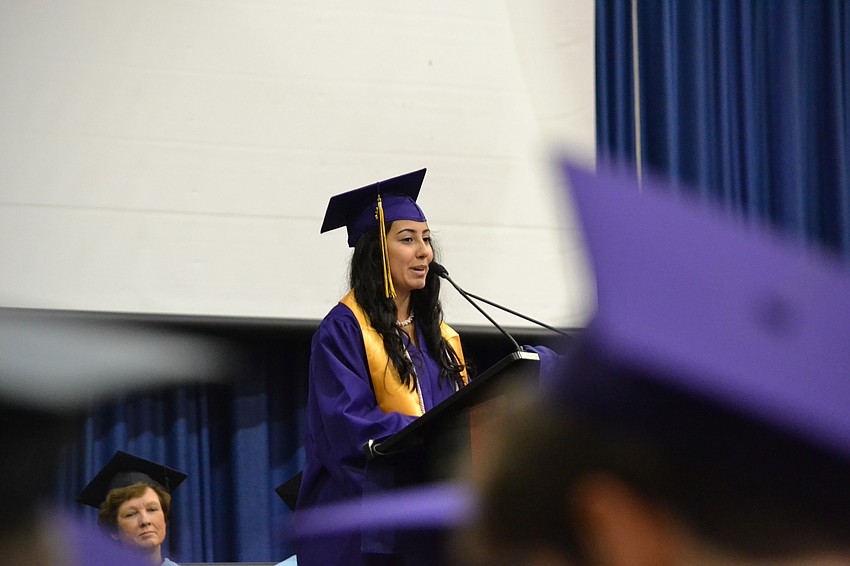 Elizabeth Betancur delivers her commencement speech to classmates.