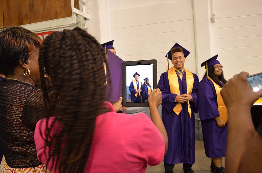 Elizabeth Brookins snaps a photo of Gerrod Jones.