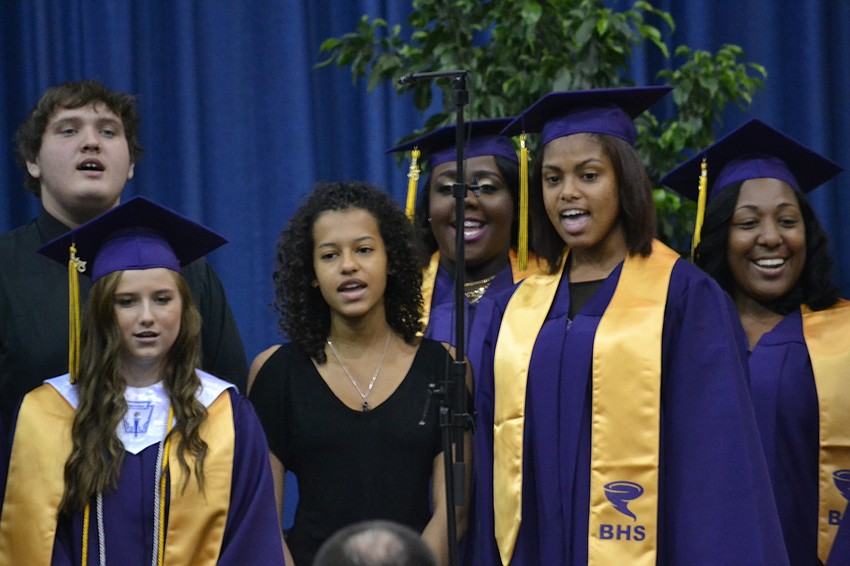 Students perform the song “Like an Eagle” during the 2015 Booker High School commencement ceremony.