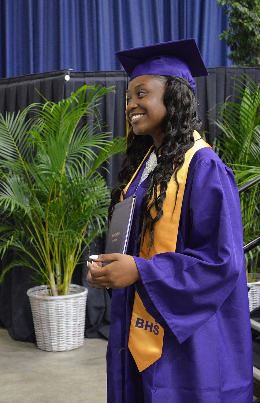 Mercedes Hill poses for a photo after receiving her diploma.