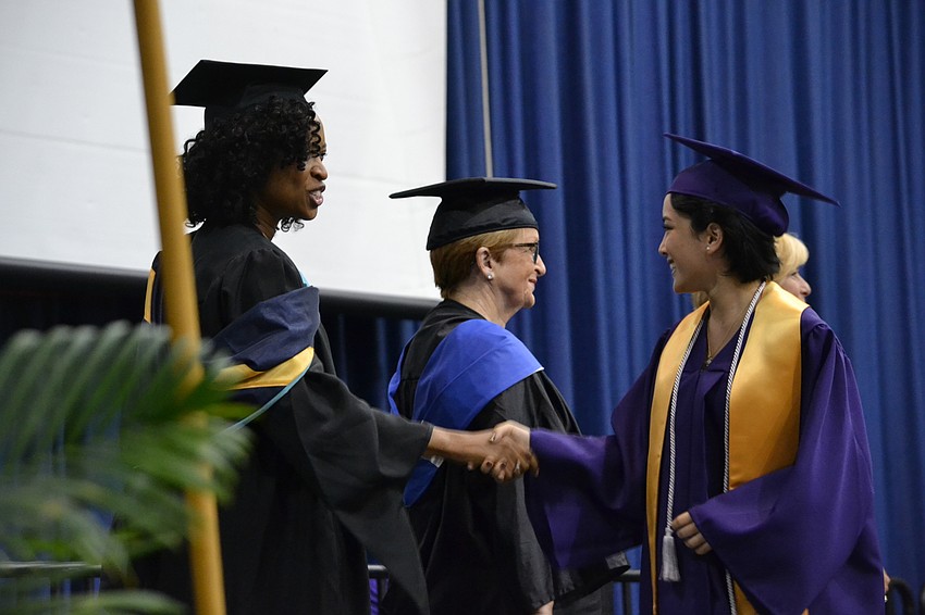 Rachel Ross receives her diploma.