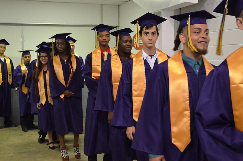 Students make their entrance as graduates.